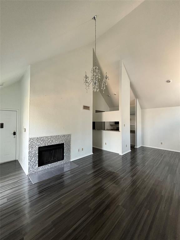 a view of a room with wooden floor and fireplace