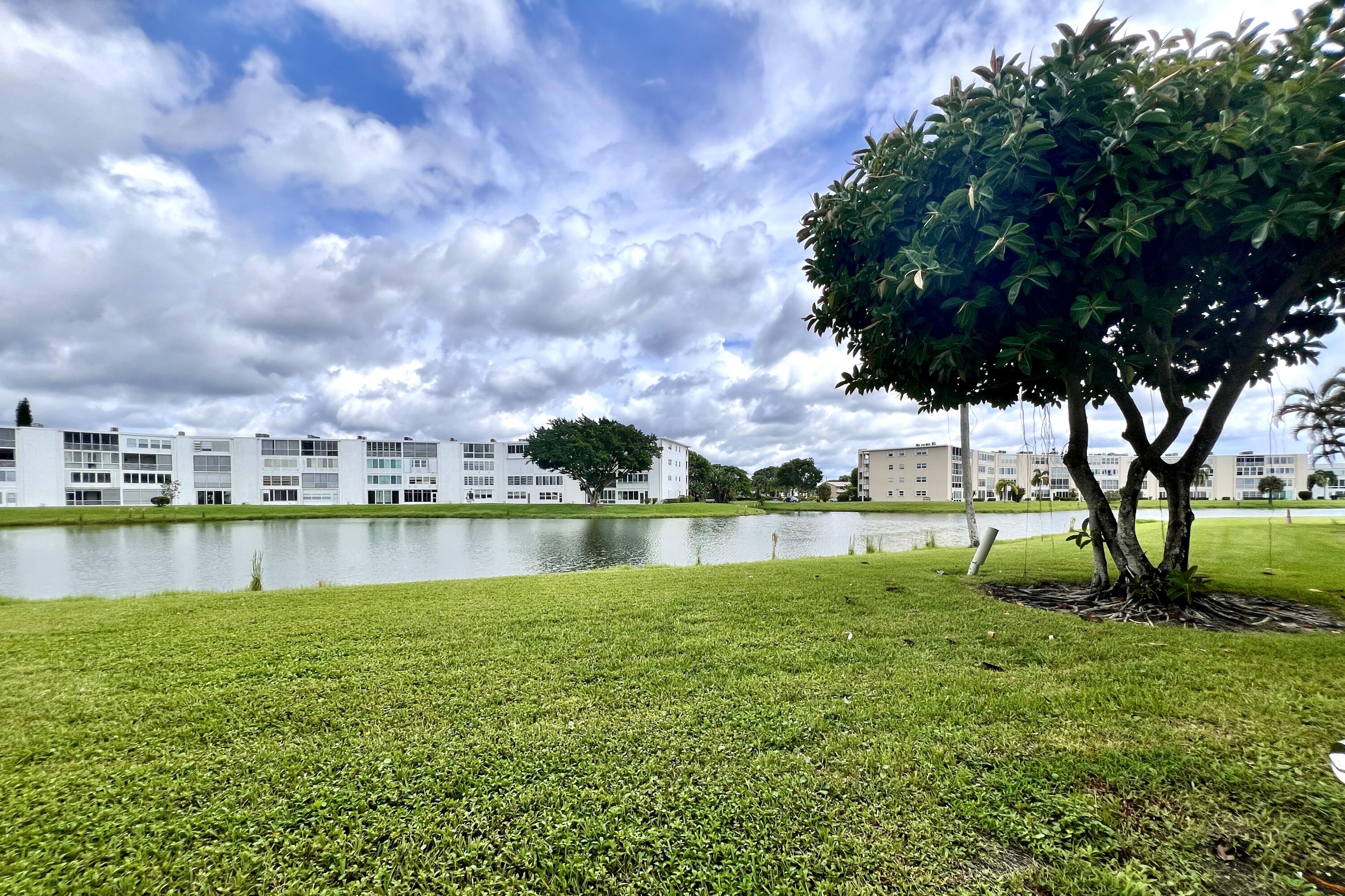 a view of a lake with a yard