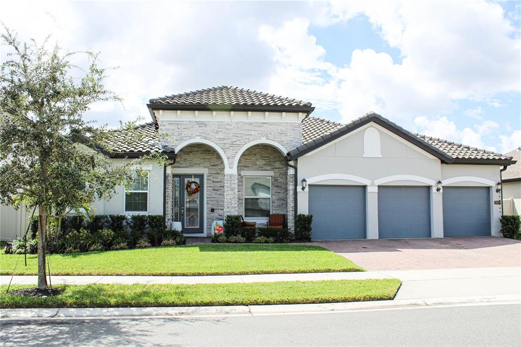 a front view of a house with a yard