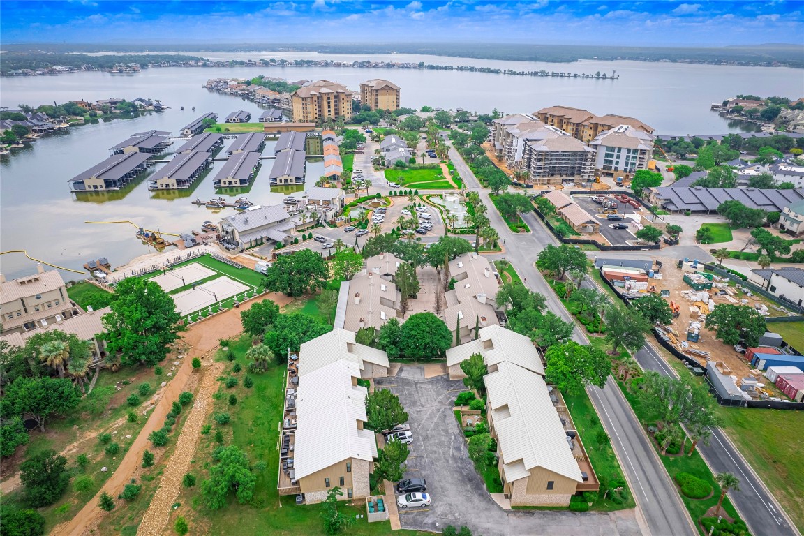 an aerial view of multiple houses with yard