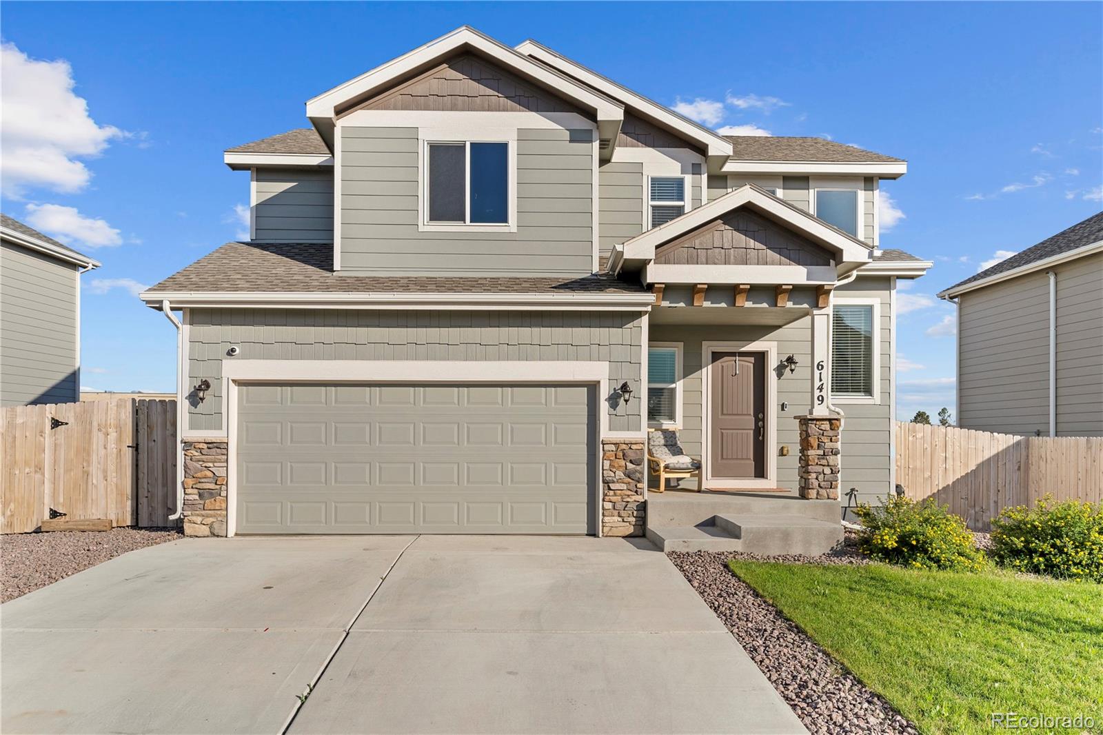 front view of a house with a yard