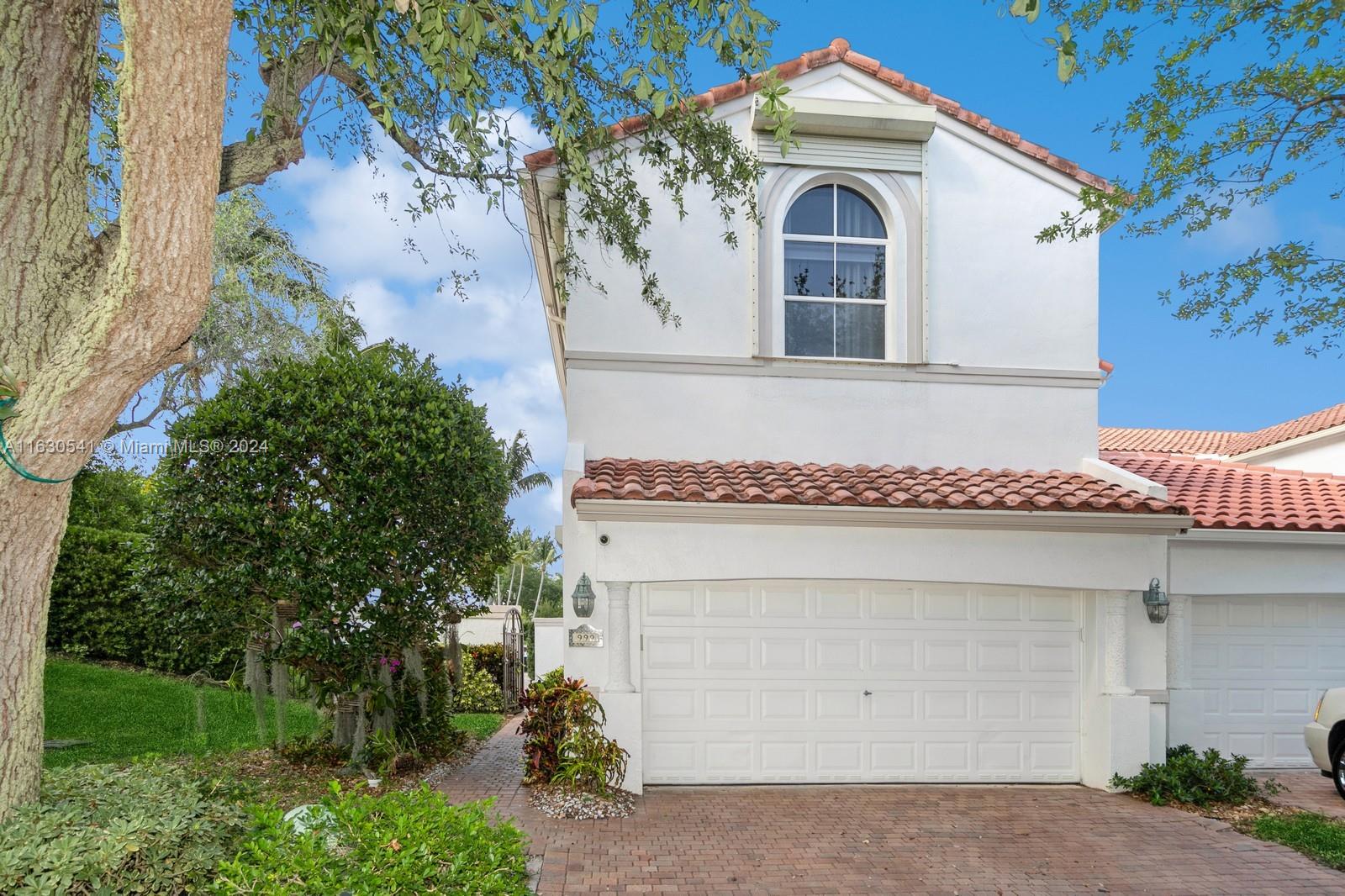 a front view of a house with a garage