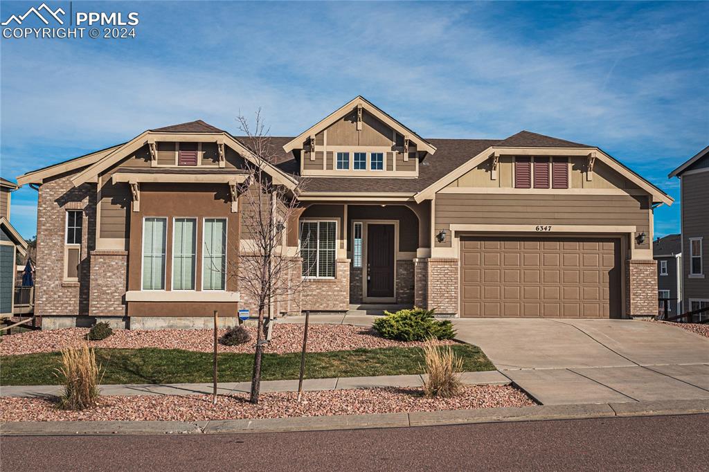 Craftsman inspired home featuring a garage