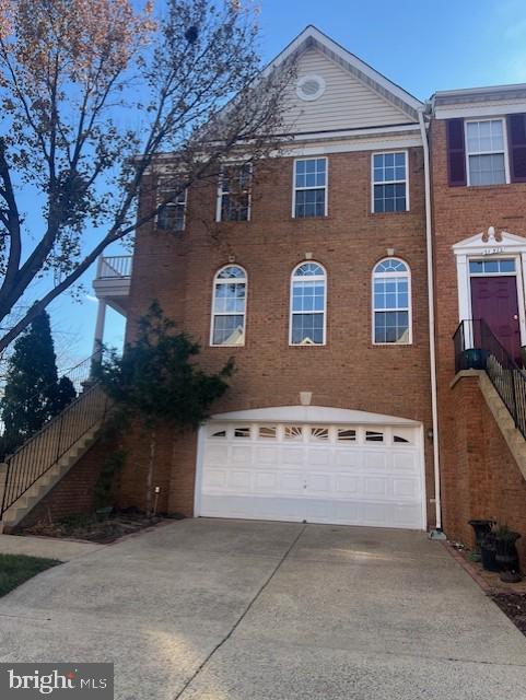 a front view of a house with yard