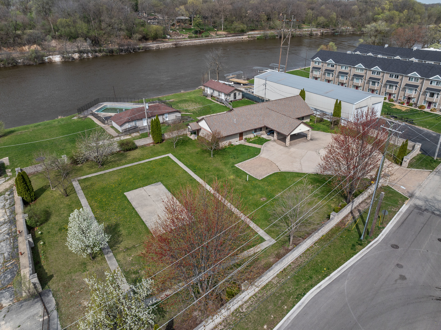 an aerial view of a house with a lake view