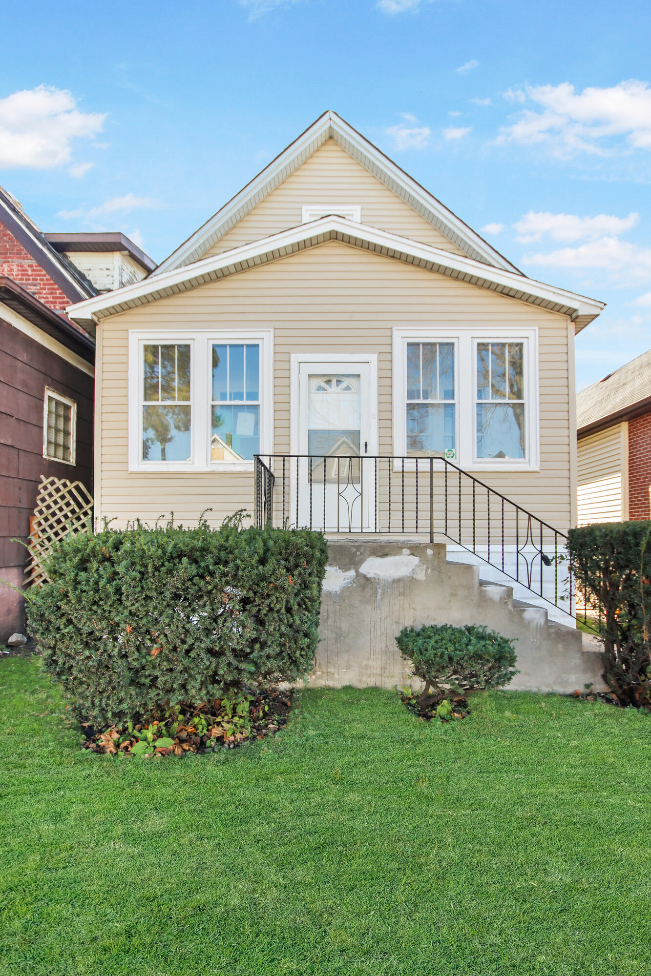 a front view of a house with garden