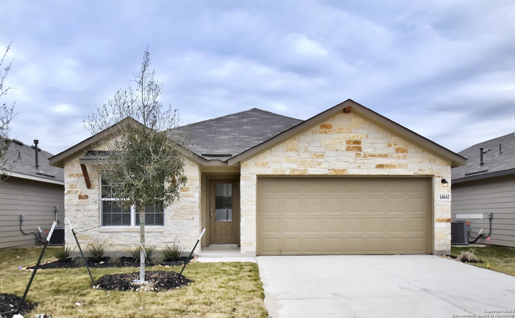 a view of a house with backyard porch and sitting area