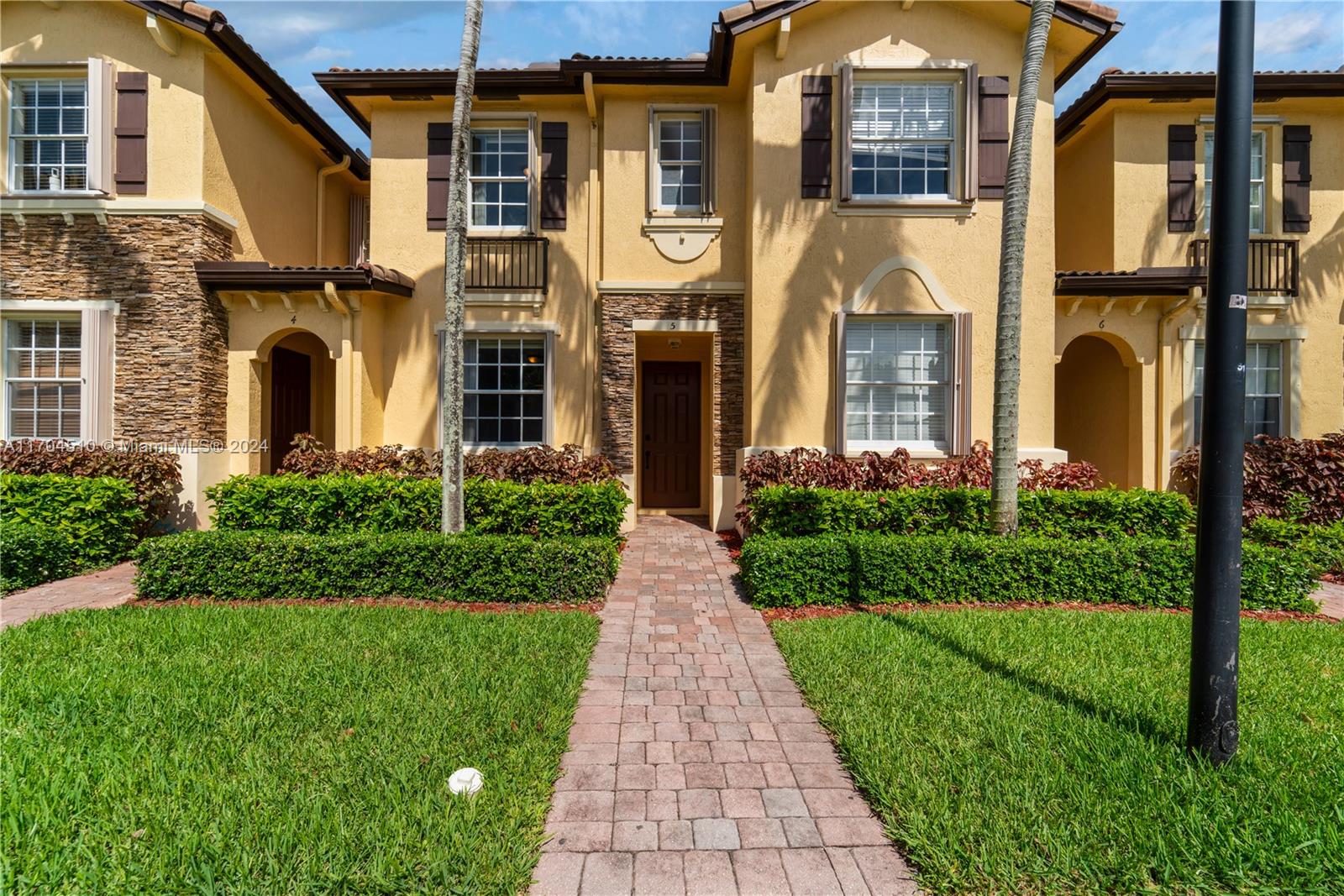 a front view of a house having yard