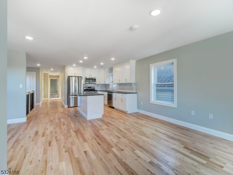 a view of kitchen with wooden floor