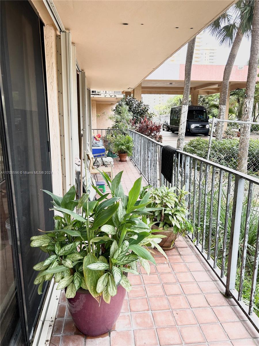 a view of a chairs and table in a balcony