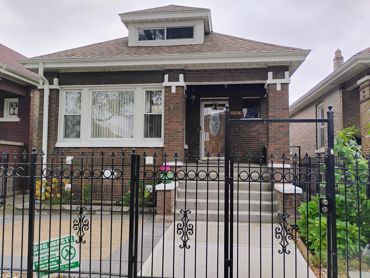 a front view of a house with a porch