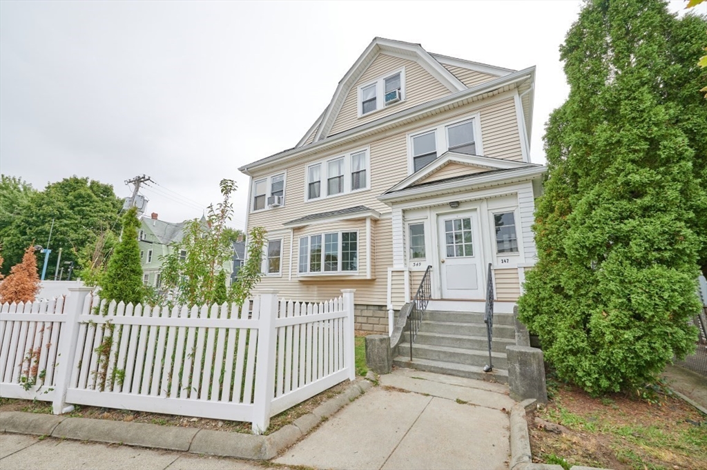 a front view of a house with a porch