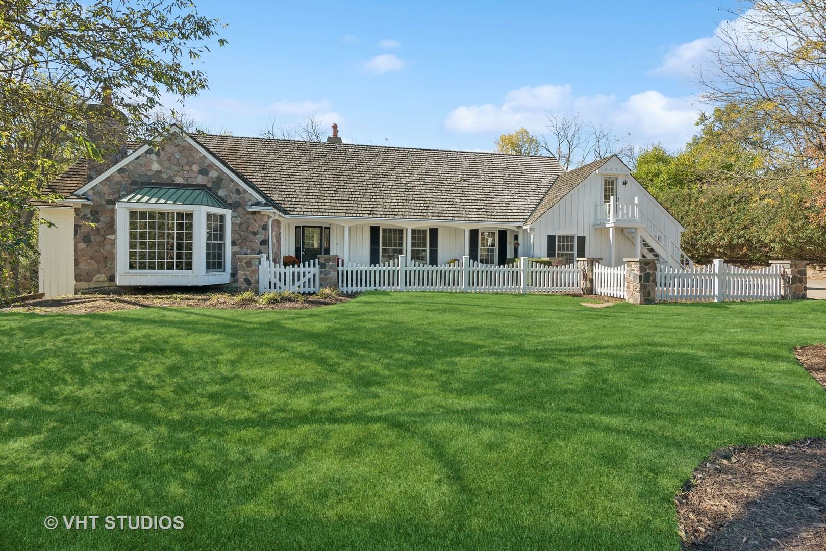 a front view of house with yard and green space