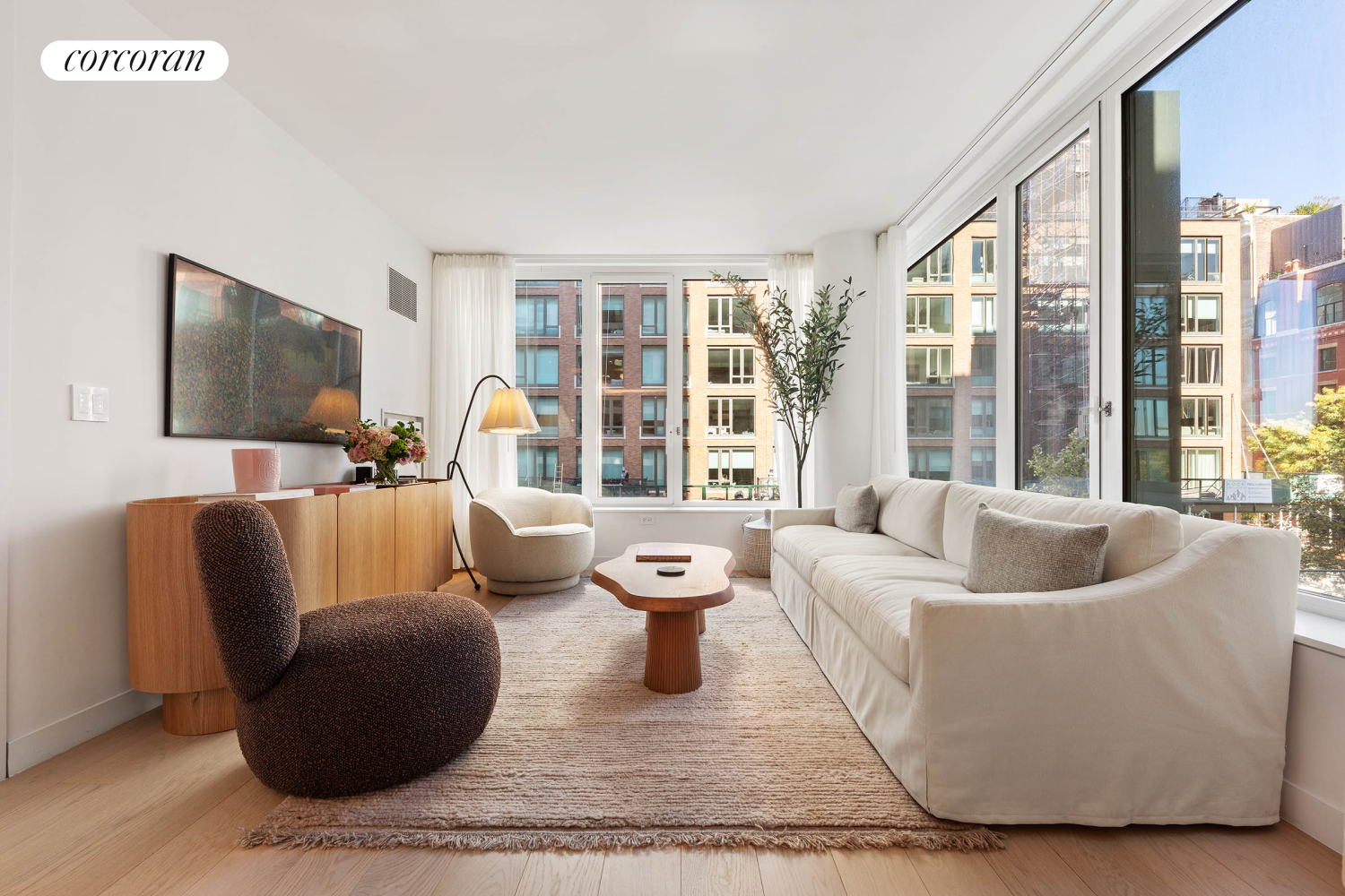 a living room with furniture and a flat screen tv