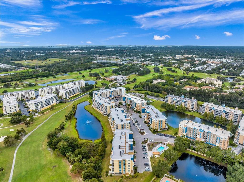 a view of a city with a lake