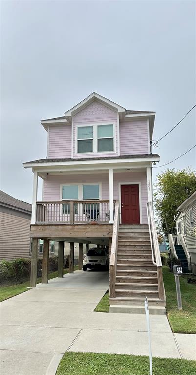 a view of a house with wooden deck