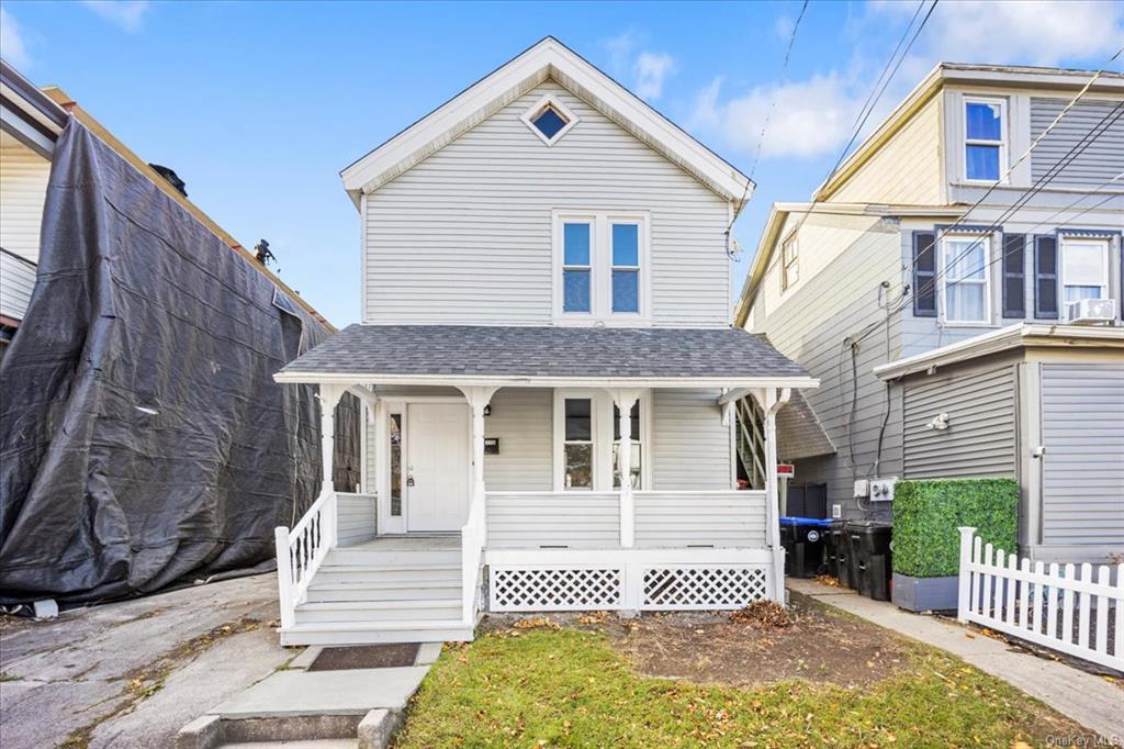 View of front of property featuring covered porch