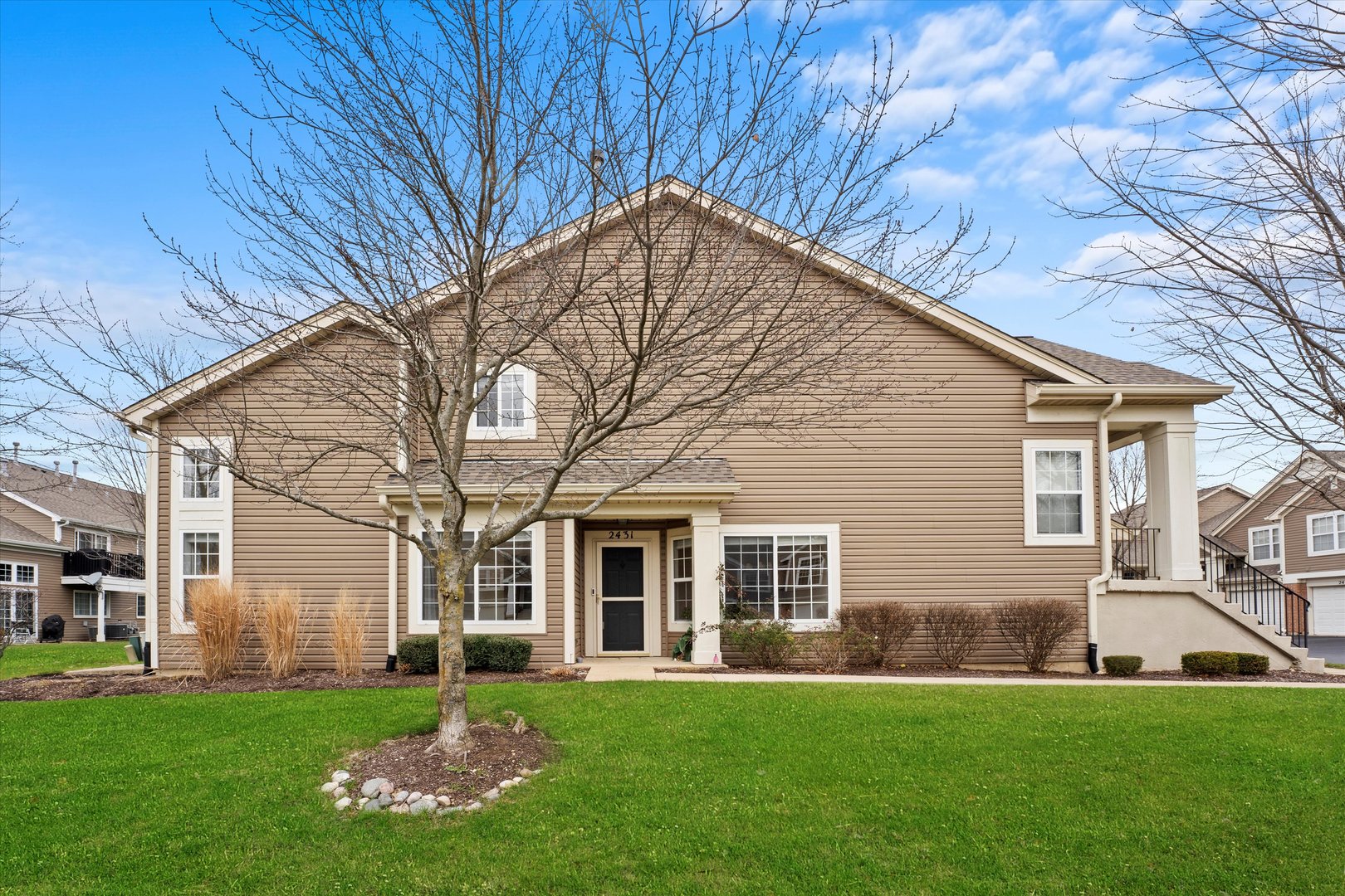 front view of a house with a yard