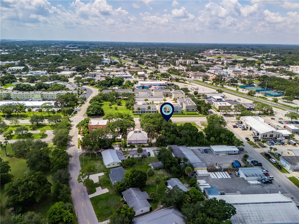 an aerial view of residential houses with outdoor space