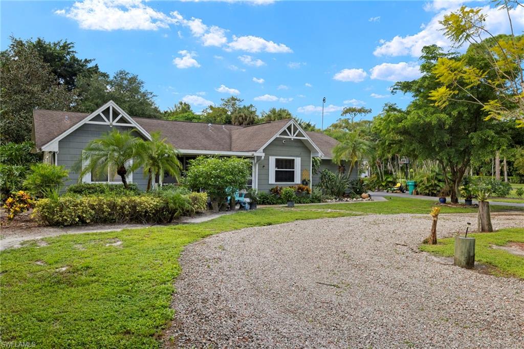 View of front of property with a front yard