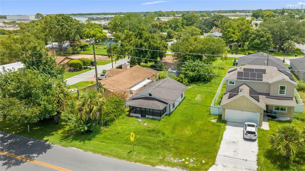 an aerial view of a house with a garden and swimming pool