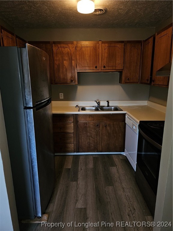 a kitchen with wooden cabinets and a stainless steel appliances