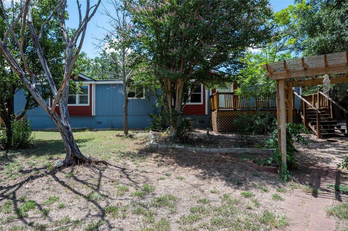 a view of backyard with green space