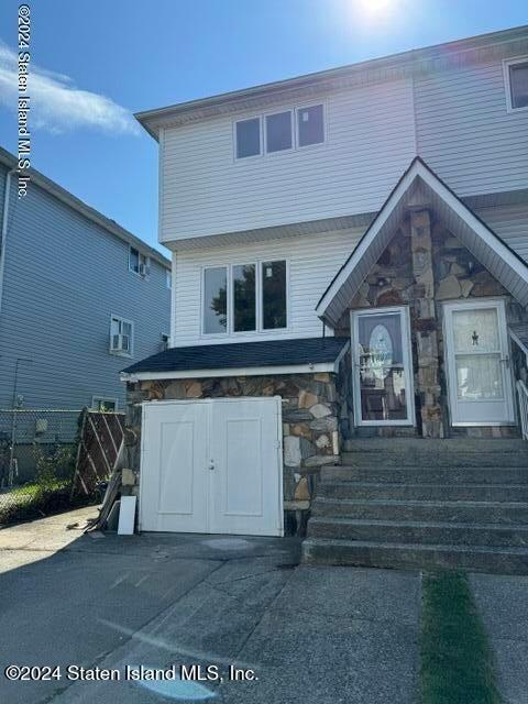 a view of a house with a street