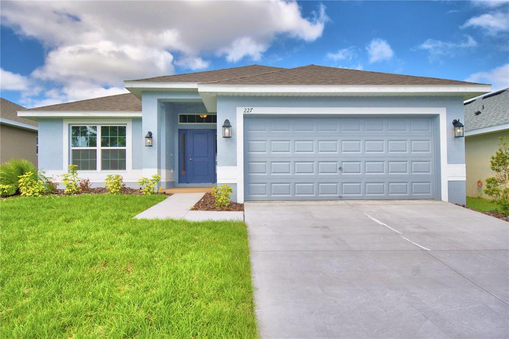 front view of a house with a yard