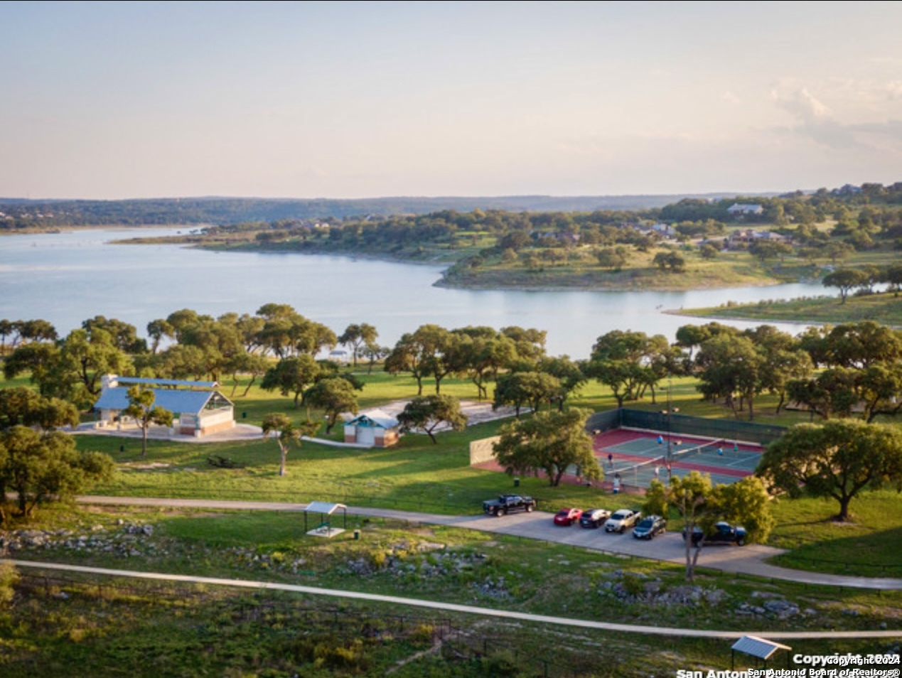 an aerial view of a city with lots of residential buildings lake and ocean view