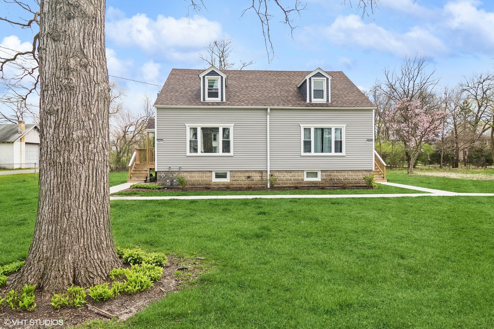 a front view of a house with a yard