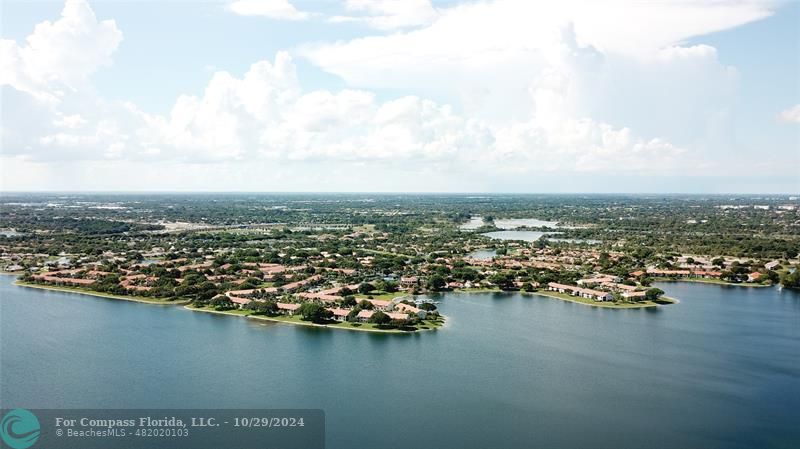 an aerial view of city and lake