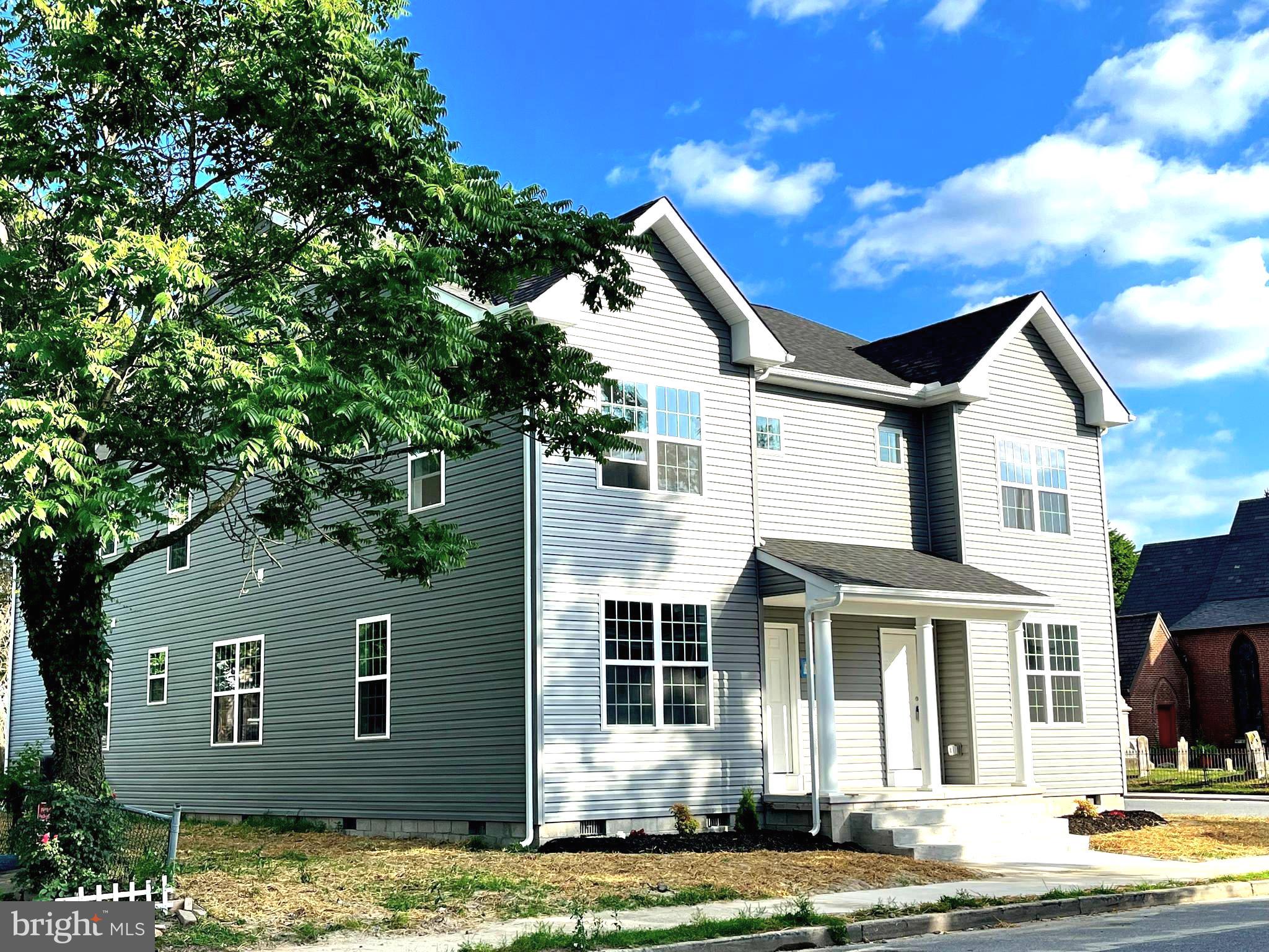 front view of a house with a yard