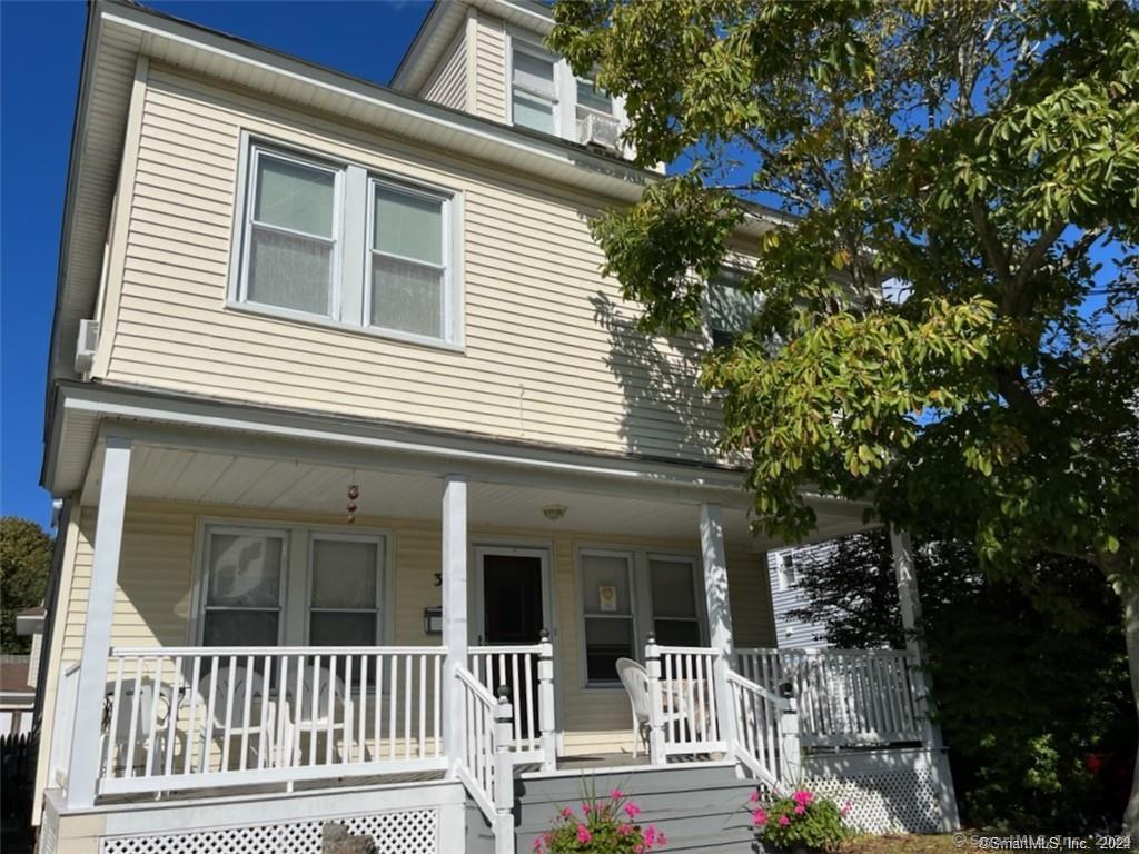 a front view of a house with a porch