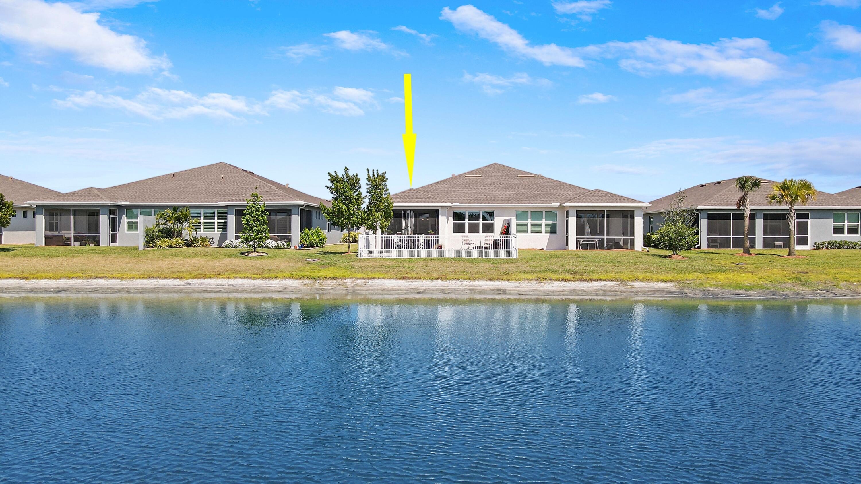 a view of a swimming pool in front of house