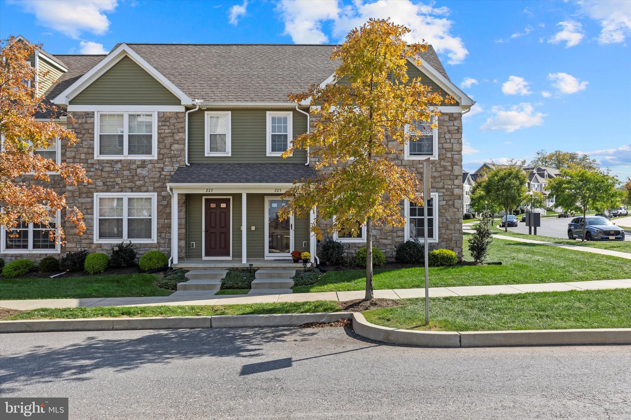 a front view of a house with a yard