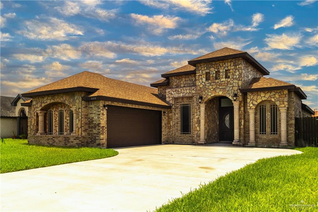 a front view of a house with a yard