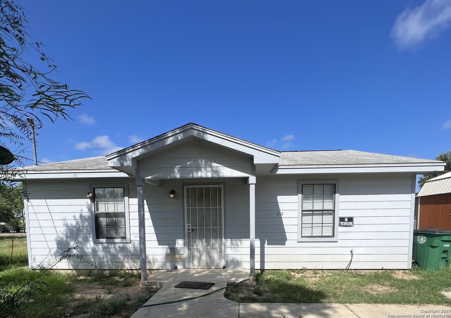 front view of a house with a yard