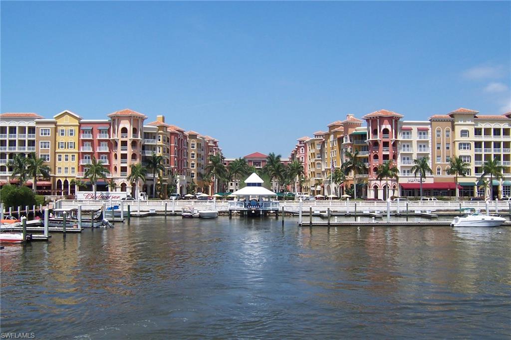 a view of residential houses with swimming pool and lake view