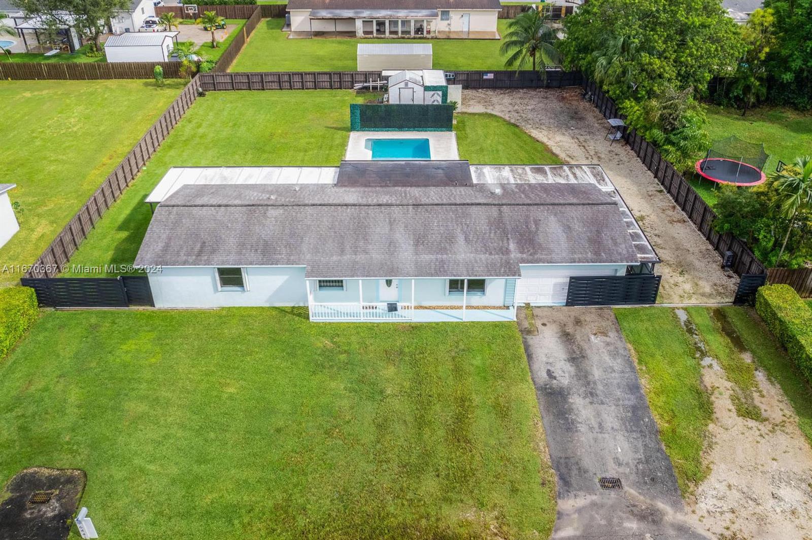 a view of yard with swimming pool