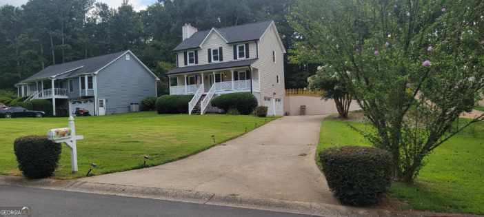 a front view of a house with yard