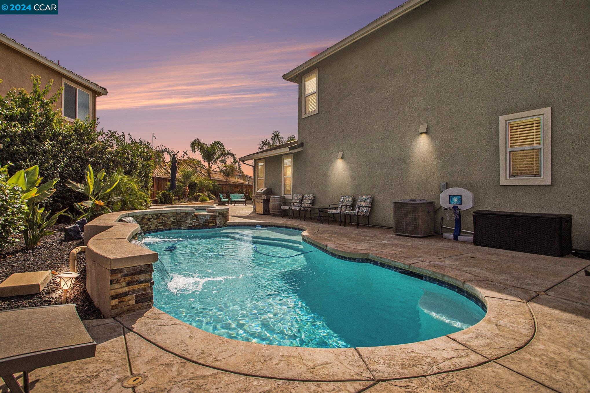 a view of a swimming pool with a patio