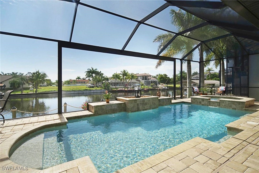 a view of swimming pool with a patio