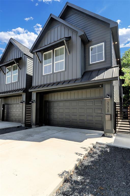 a front view of a house with a garage