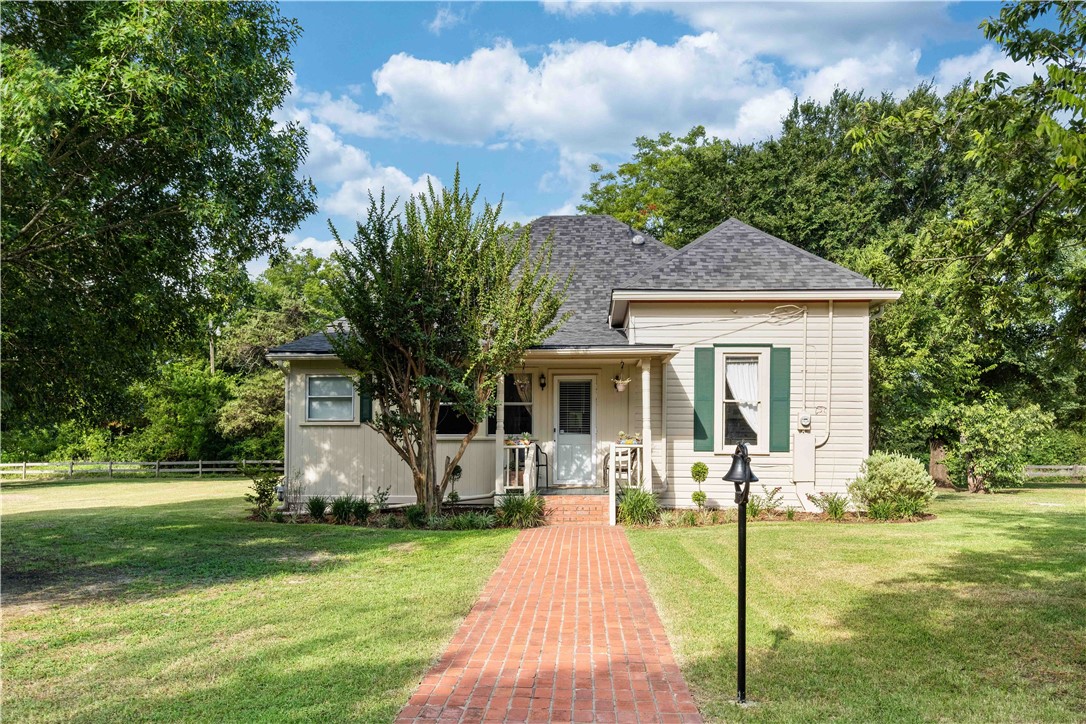 a front view of house with garden