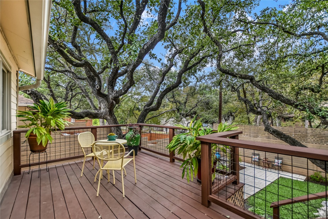 a view of a balcony with furniture