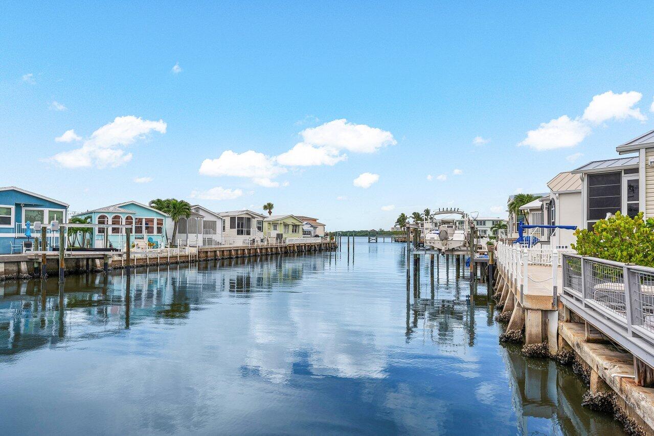 a view of a lake with a building and outdoor space