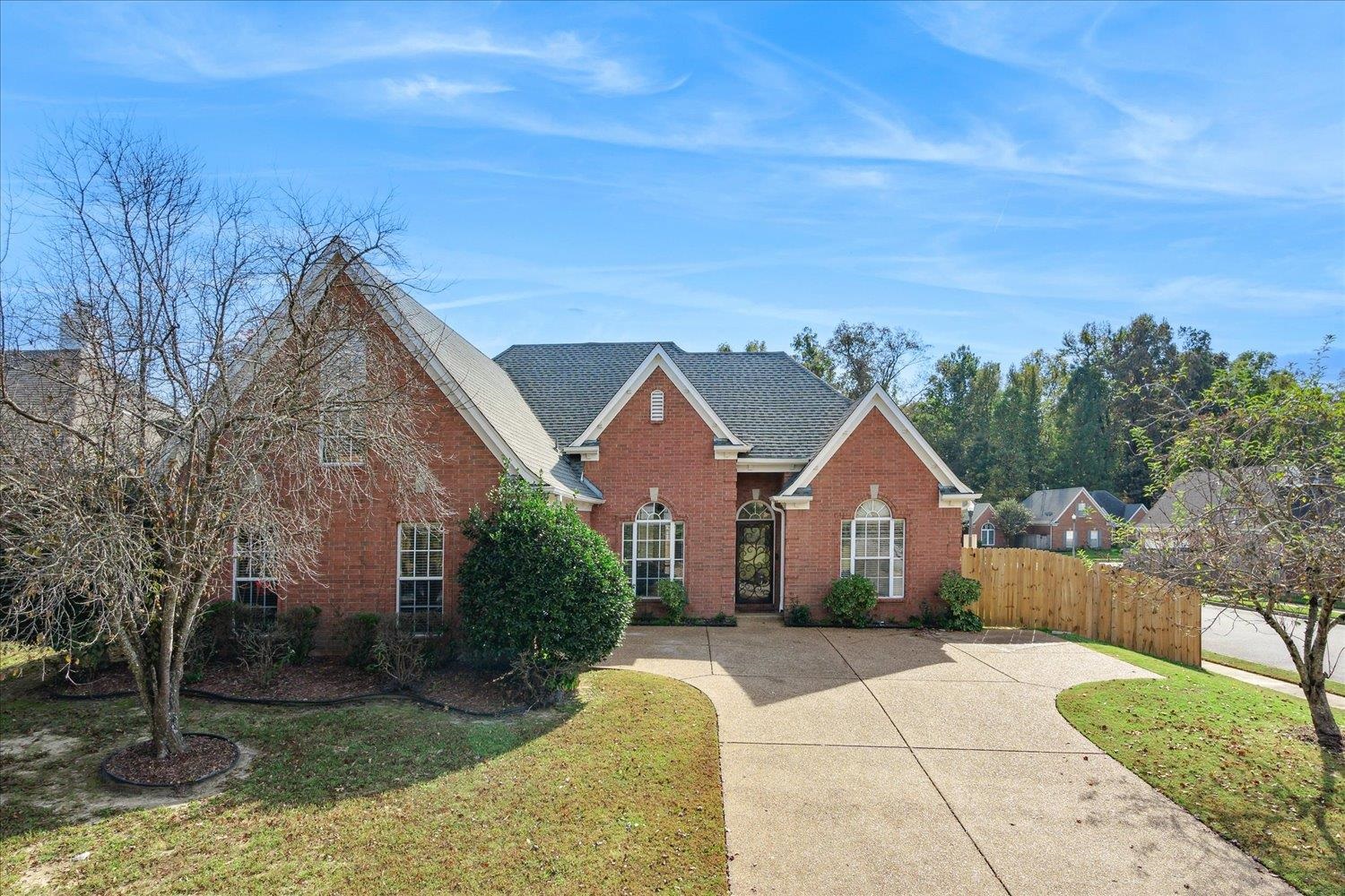 a view of house with backyard