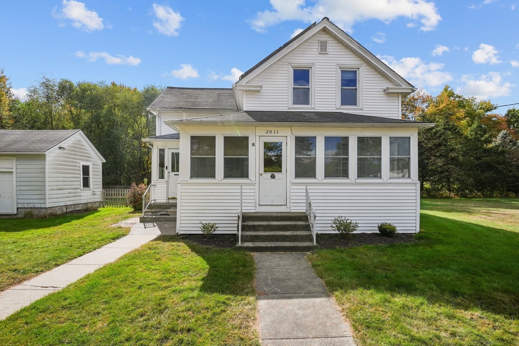 a front view of a house with a yard