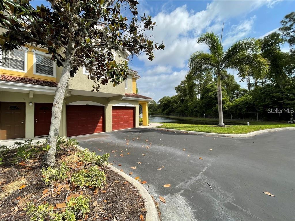 a view of a house with a yard and garage